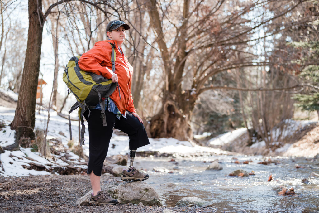 Woman wearing Motion Foot SLX by a river.