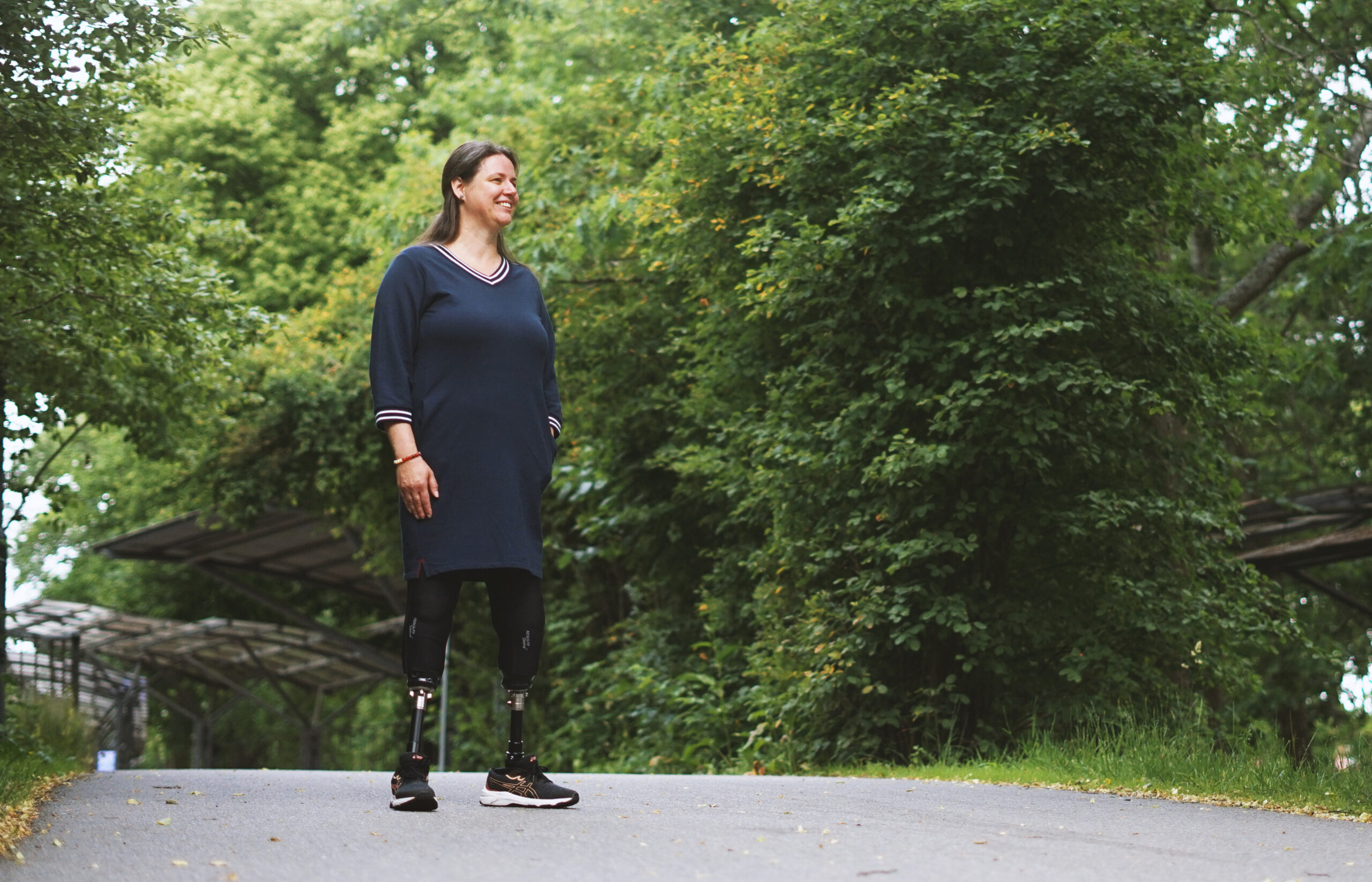 Bi-lateral amputee on a sidewalk wearing the Motion Foot SLX.