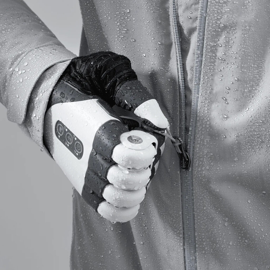 TASKA HandGen2 zipping up a wet jacket